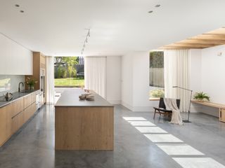 a modern kitchen with a concrete floor