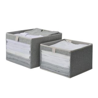 Two gray storage bins with open top and mesh panel in the front showeing the t shirts folded inside