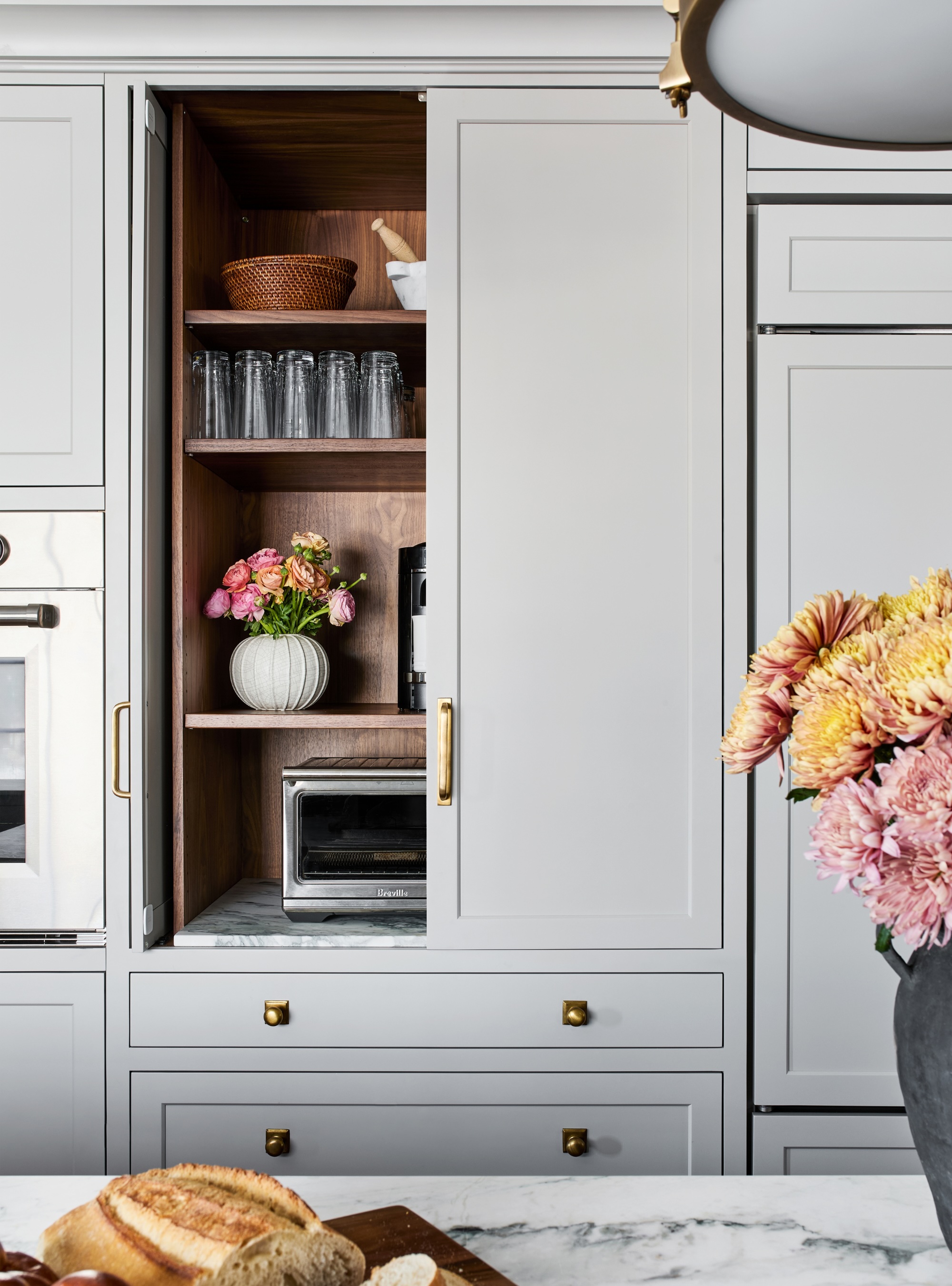 Pocket door appliance garage in grey kitchen