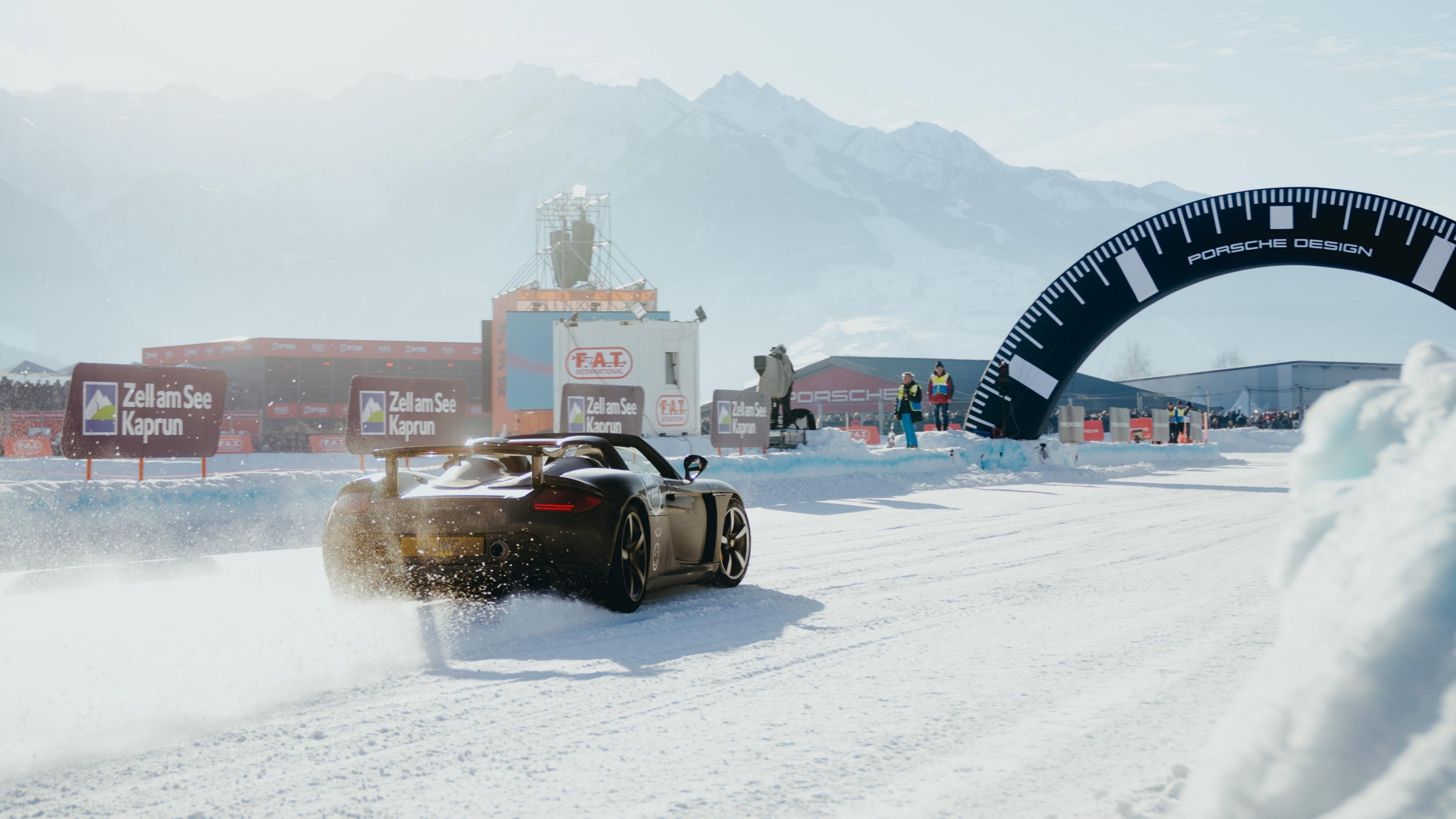 A carrera GT slides through the timing gate at FAT ICE race