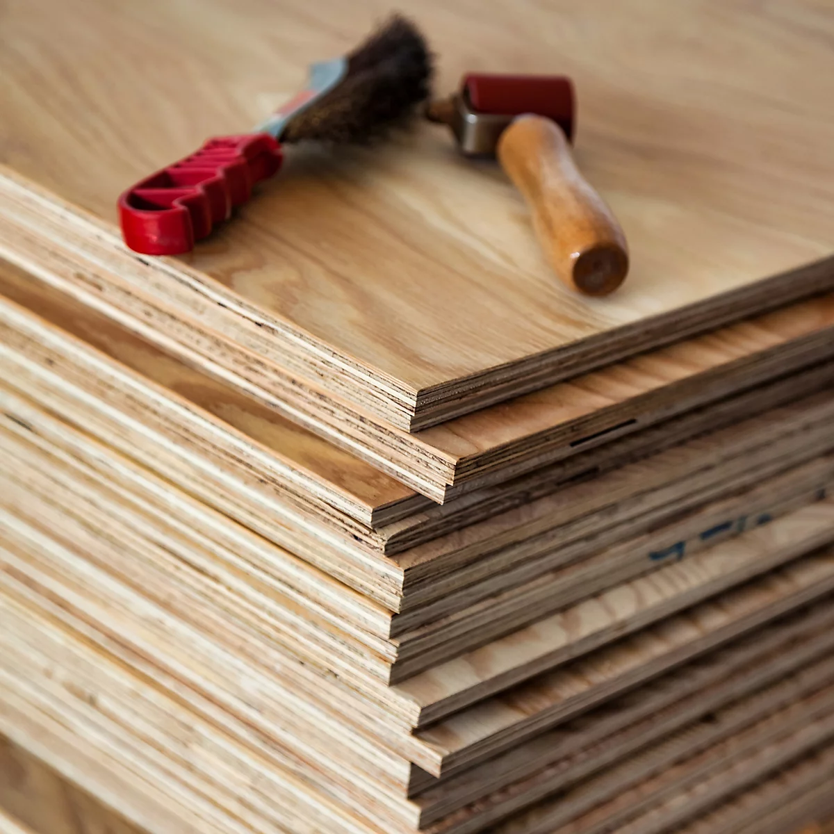 Pile of Arranwood Marine Plywood with tools on top