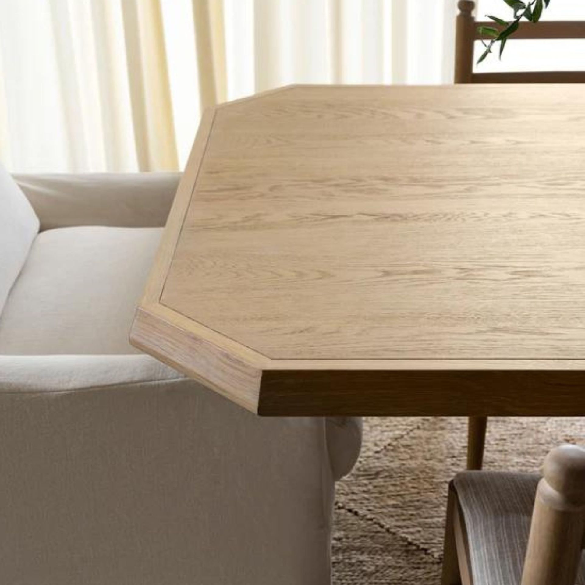 The end of a wooden tapered dining table