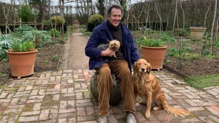 Monty Don posing with his dogs on Gardeners' World