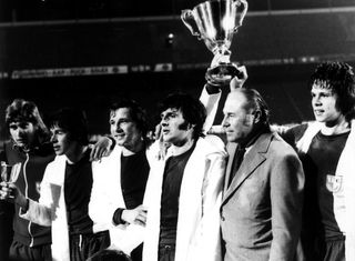 FC Magdeburg players and coach Heinz Krügel celebrate with the trophy after victory over AC Milan in the European Cup Winners' Cup final in May 1974.