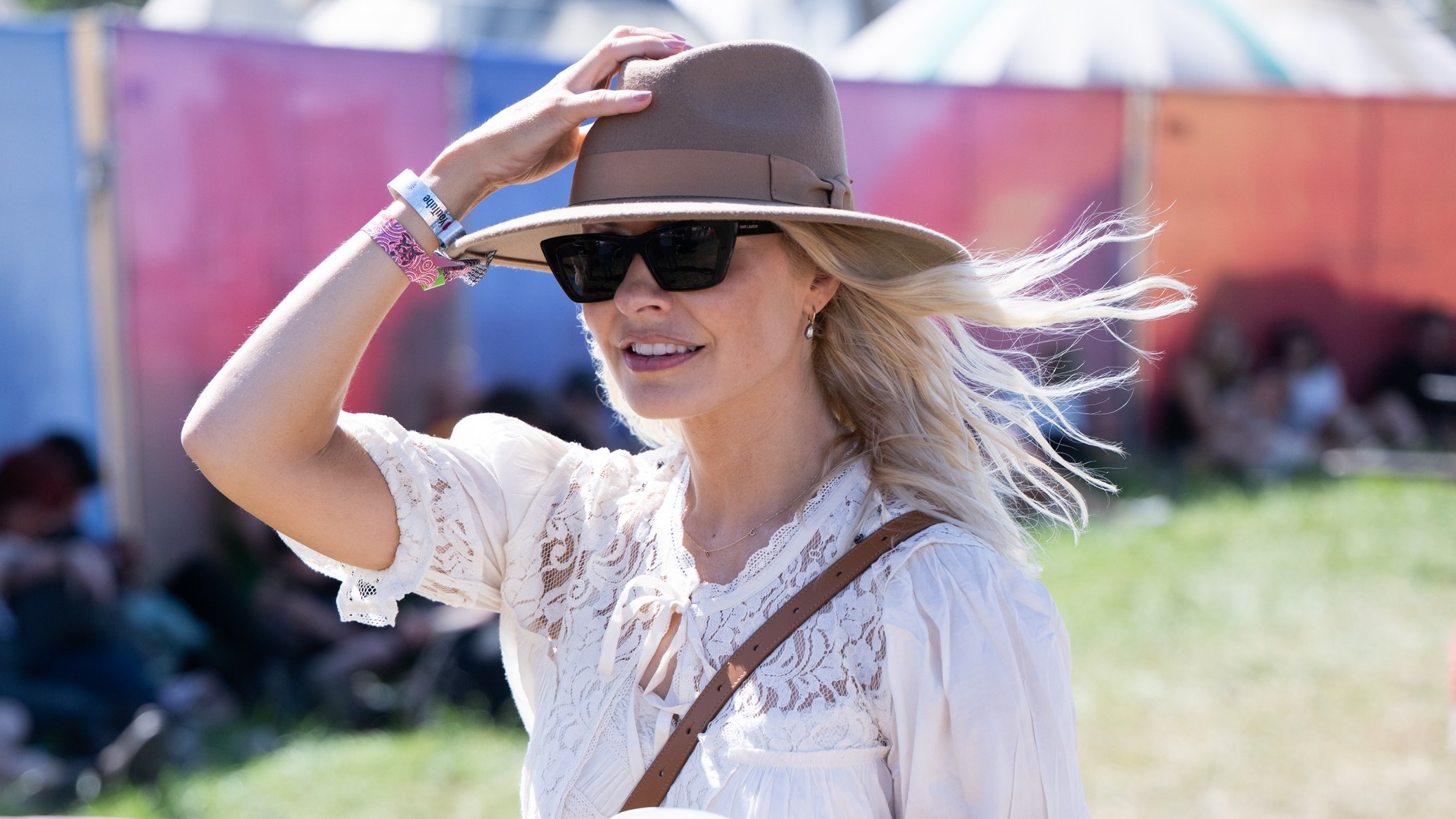 Holly Willoughby holds her hat on her head during day three of Glastonbury festival 2025 at Worthy Farm, Pilton on June 27, 2025
