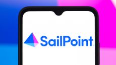 SailPoint logo and branding pictured on a smartphone screen with company brand coloring in background.