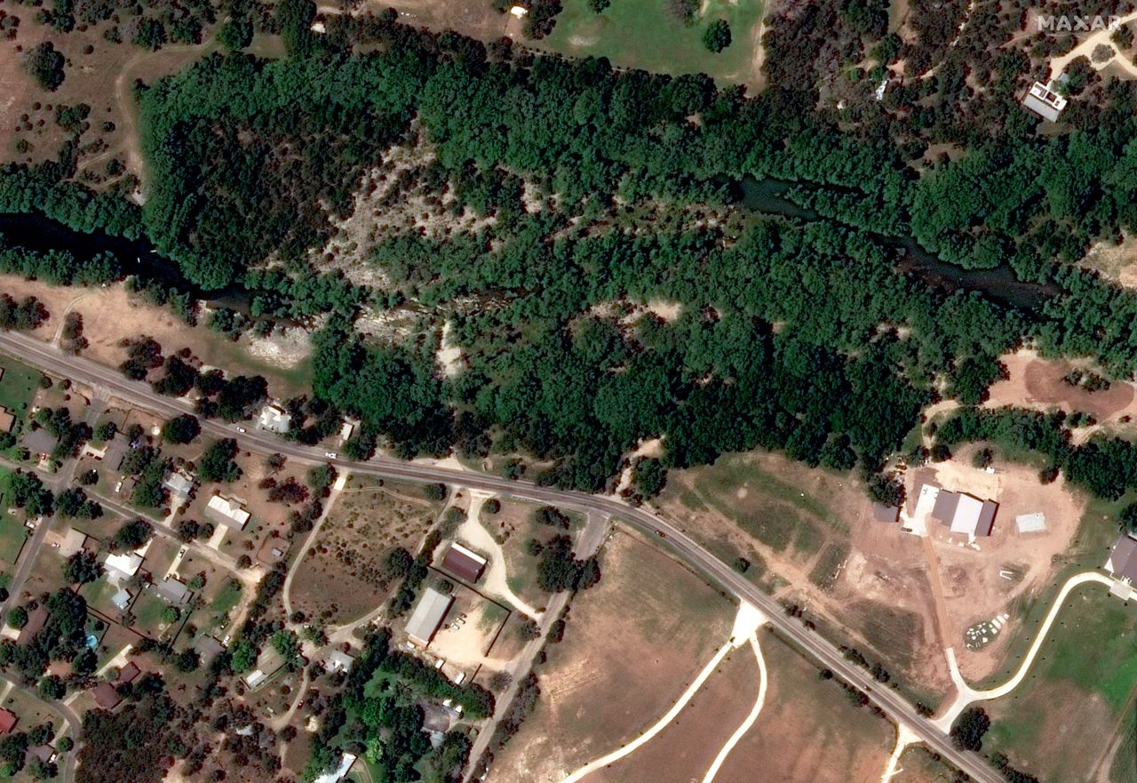 A satellite photograph of trees beside the Guadalupe River on June 23, 2023.
