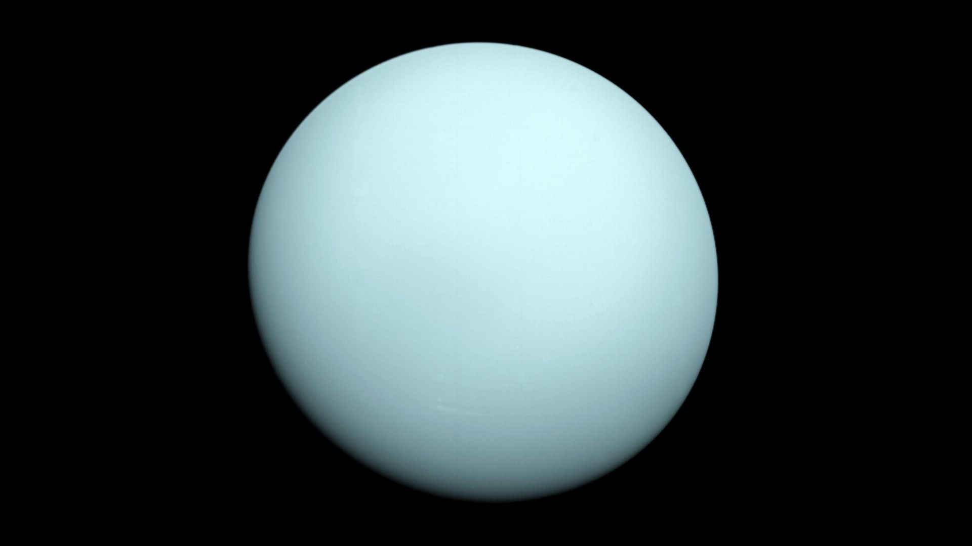photo of pale blue disk of Uranus