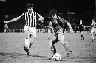 Luciano Favero of Juventus looks to block Liverpool's Craig Johnston in the 1985 European Cup final.