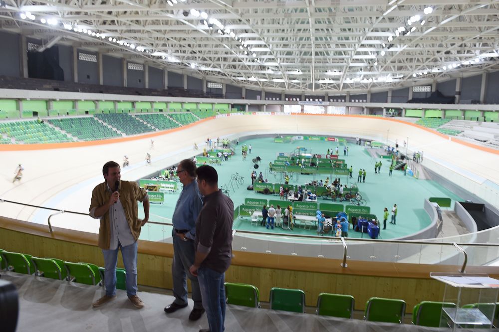 Rio's Mayor Eduardo Paes (L) accompanied by Carlos Arthur Nuzman (C), president of the local Olympic Games Organizing Committee and by Brazilian Sport Minister Leonardo Picciani (R) delivers a speech during the inauguration of the Velodrome of the Olympic Park in Rio