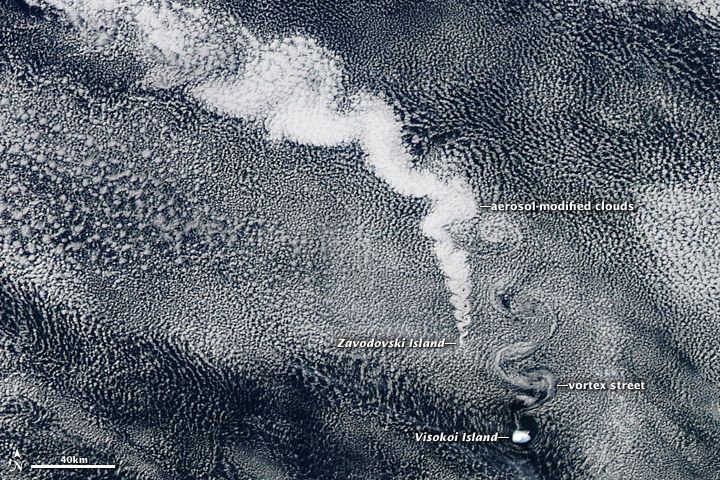 Emissions from volcano creates shapes in clouds over ocean