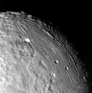 A black and white image of an icy moon