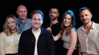 Natural Six cast photographed against a black background. From left to right: Aoife Wilson, Doug Cockle, Harry McEntire, Ben Starr, Hollie Bennett, Alex Jordan