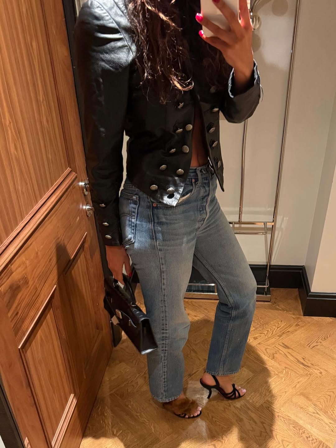 woman wearing heels with jeans spring outfit 2026