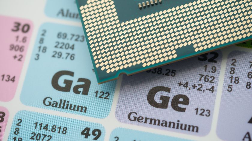 An image of a processor resting on a periodic table, with Ge (Germanium) and Ga (Gallium) being the elements in focus