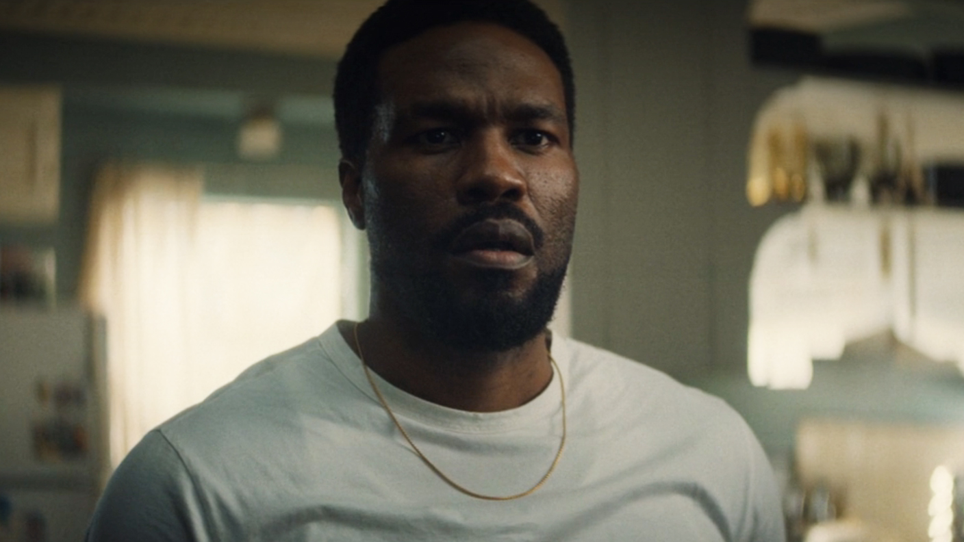 Simon Williams looking worried as he watches an off-camera news bulletin in Wonder Man episode 8