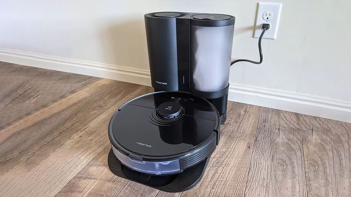 Roborock S7+ docked on floor.