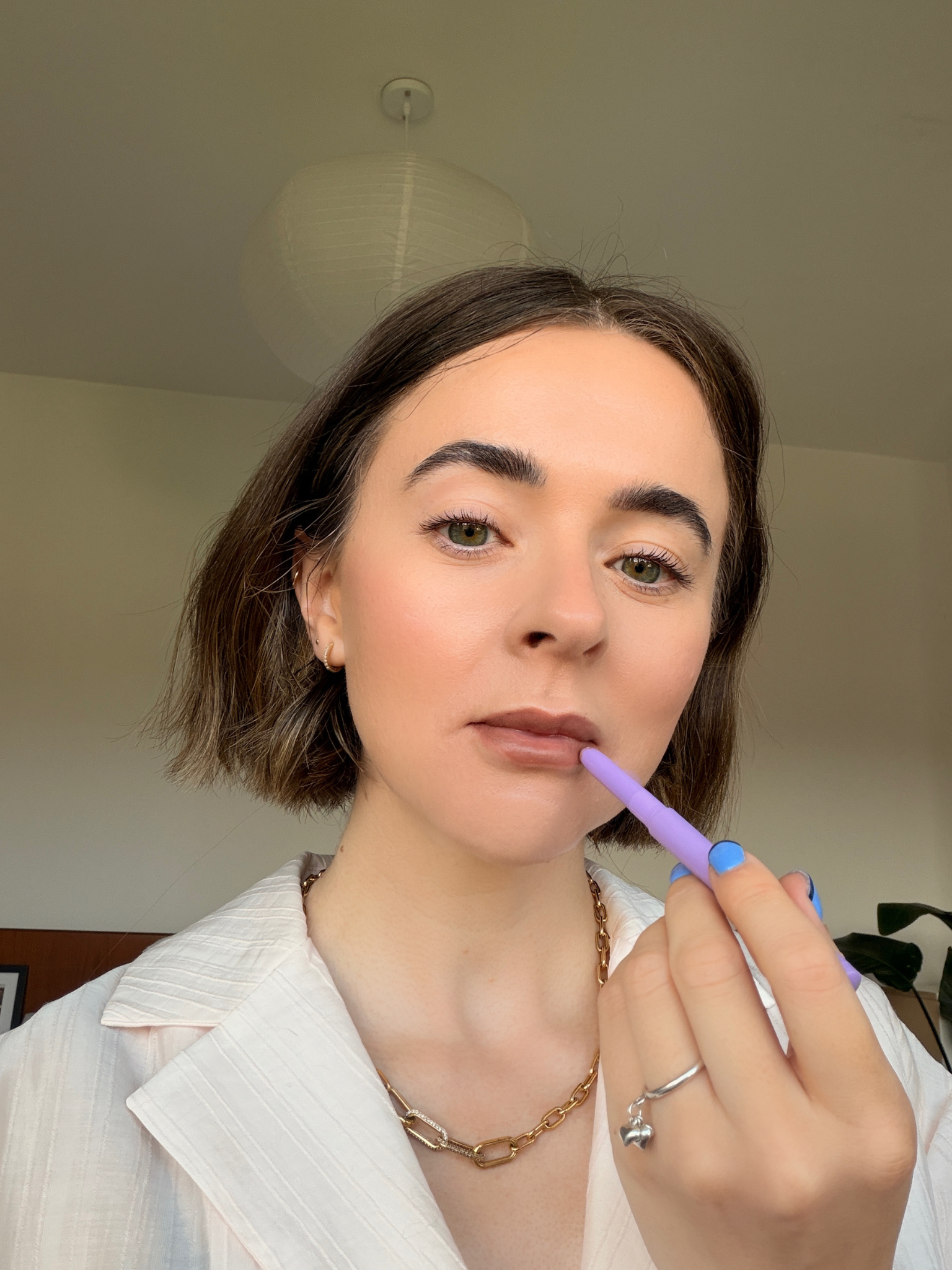 Freelance beauty editor Grace Day wearing KJHBrand's lipstick in Etch
