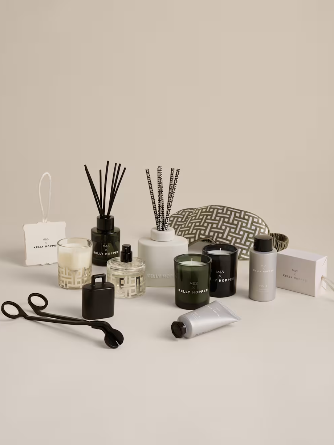 An advent calendar from M&amp;amp;S x Kelly Hoppen including votives, diffusers, body care, and a candle wick trimmer