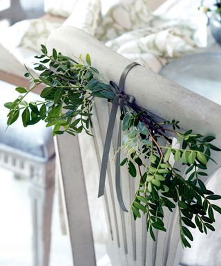 Chair back decorated with garden foliage