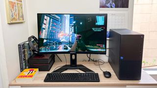 Dell XPS 8960 review unit on desk, Cyberpunk 2077 playing onscreen