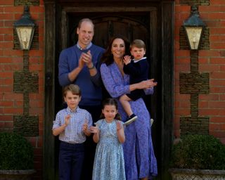 Prince William, Duke of Cambridge, Catherine Duchess of Cambridge, Prince George of Cambridge, Princess Charlotte of Cambridge and Prince Louis of Cambridge clap for NHS carers