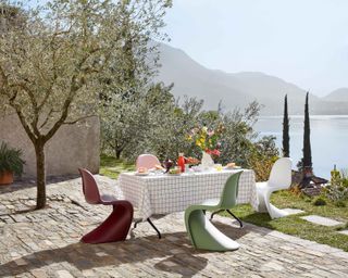 patio ideas with vitra colorful chairs overlooking lake view