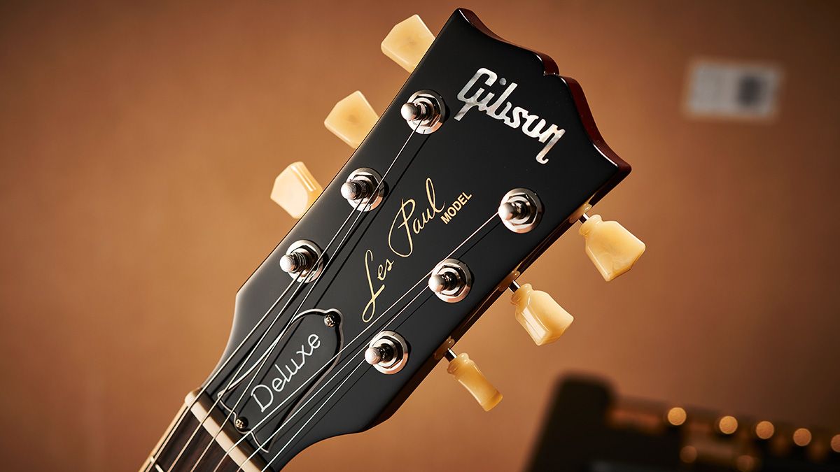 Detail of the headstock and tuners on a Gibson Les Paul 70s Deluxe electric guitar with a 70s Cherry Sunburst finish, taken on July 22, 2021