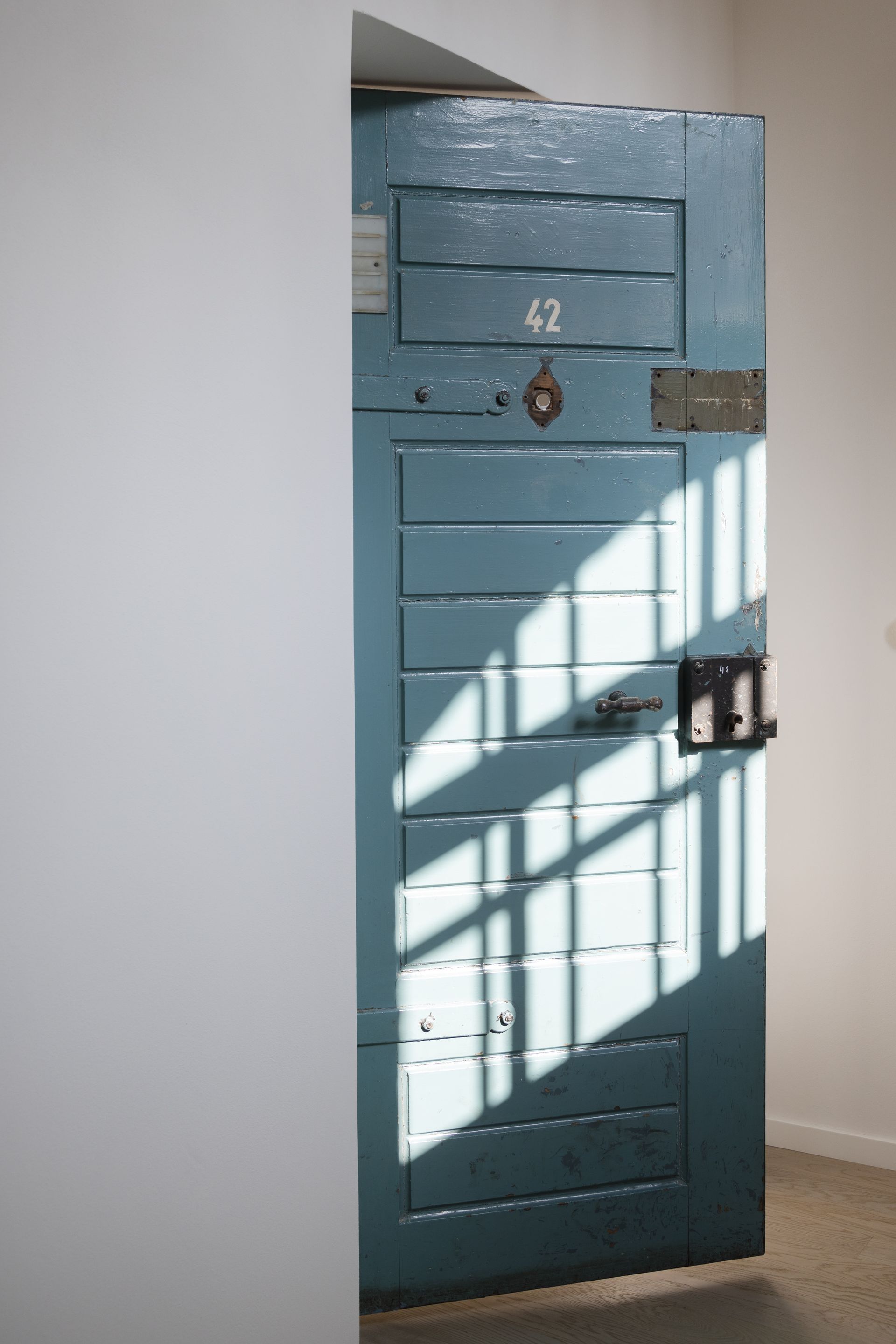 old blue door in white room