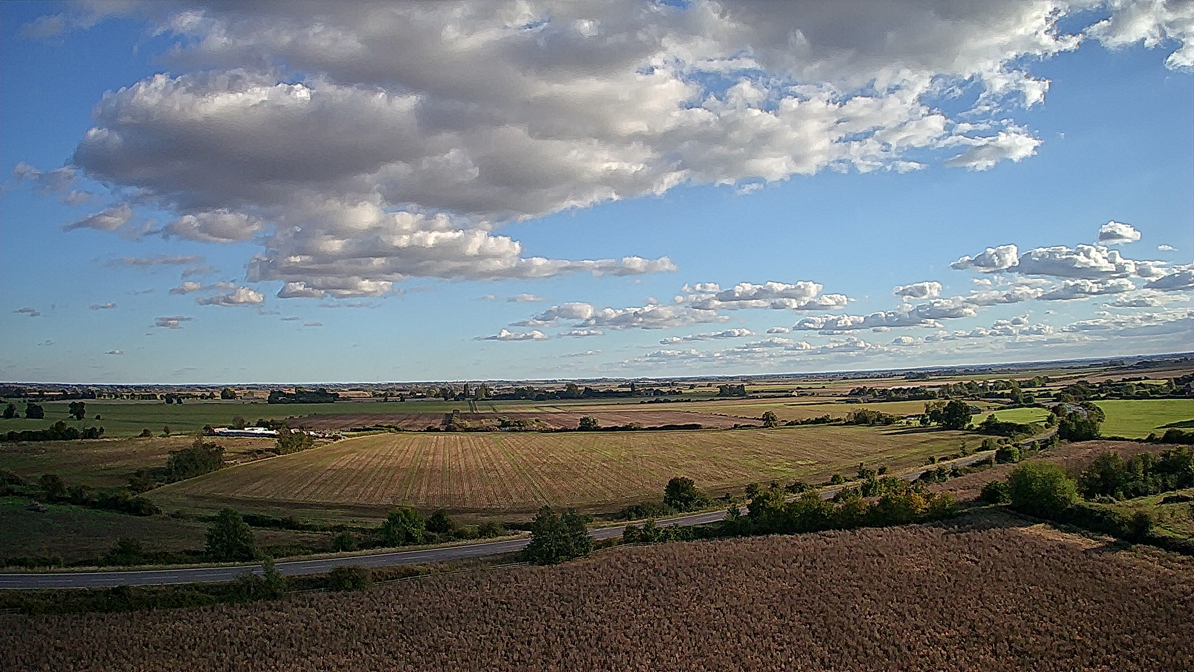 View of a field and clouds taken with Ruko U11MINI drone.