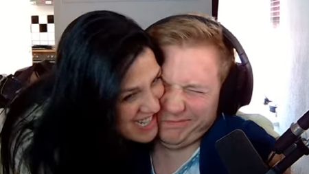 Cakez winces as his wife embraces him