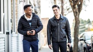 Colleagues walking down city street on their lunch break