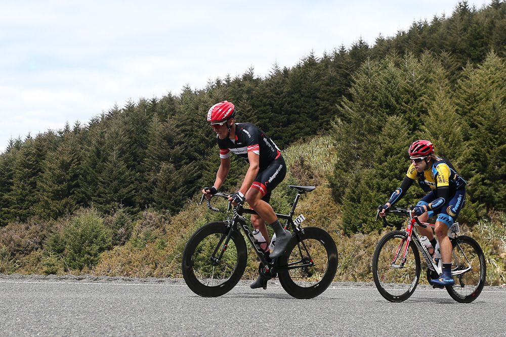 Michael Vink of Christchurch, (F) and Brad Evans of Dunedin make the climb towards Manapouri during stage three of the Tour of Southland