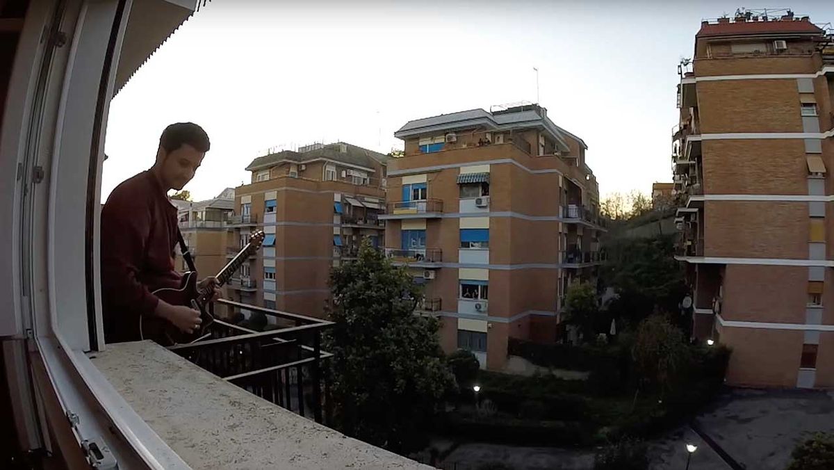 Guitarist on a balcony