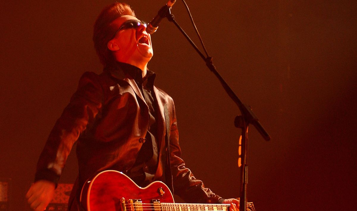 Andy Taylor performs with Duran Duran at Wembley Stadium on April 13, 2004