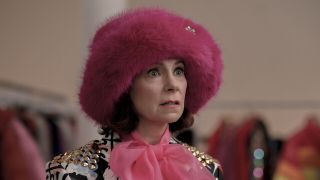 Carrie Preston wearing a pink fuzzy hat as Elsbeth in Season 1 finale