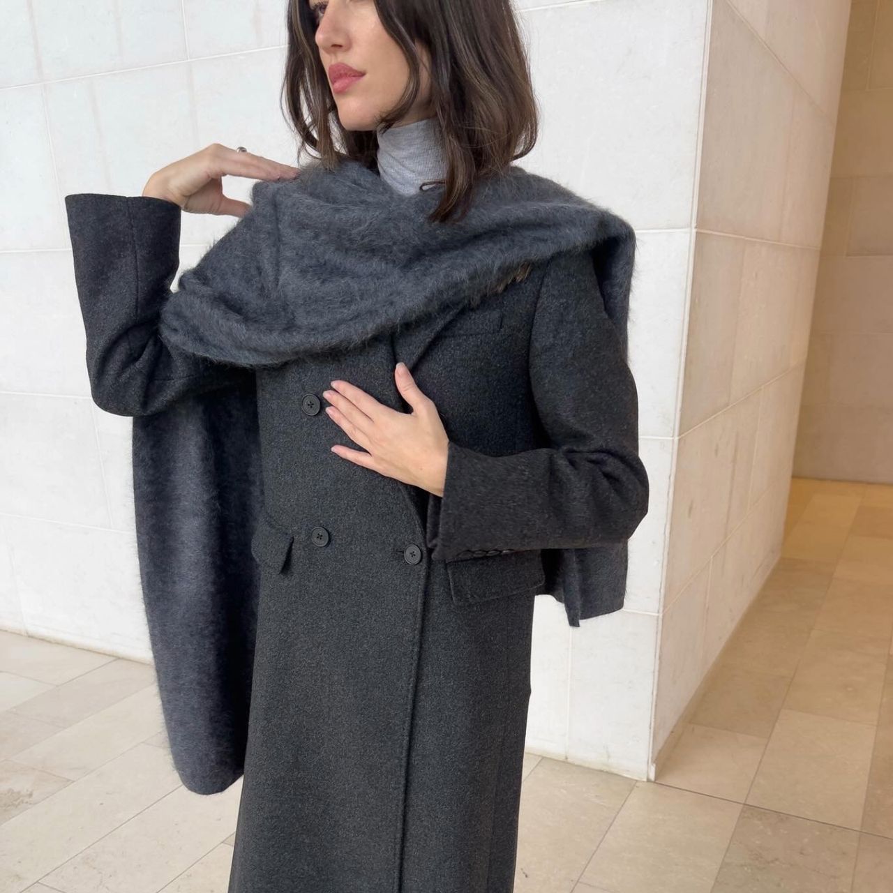 Ilirida Krasniqi in a grey Aritzia coat and scarf