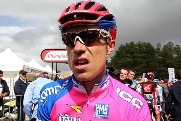Cunego breathing hard after stepping off his bike.