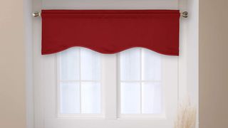 bright red scalloped window valance over window