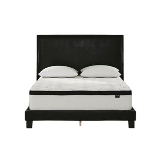 A black bed with a white mattress on it with a black trim and two white pillows on top of it