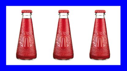 a trio of Campari soda bottles in blue background