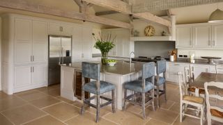large farmhouse kitchen with kitchen island and beams