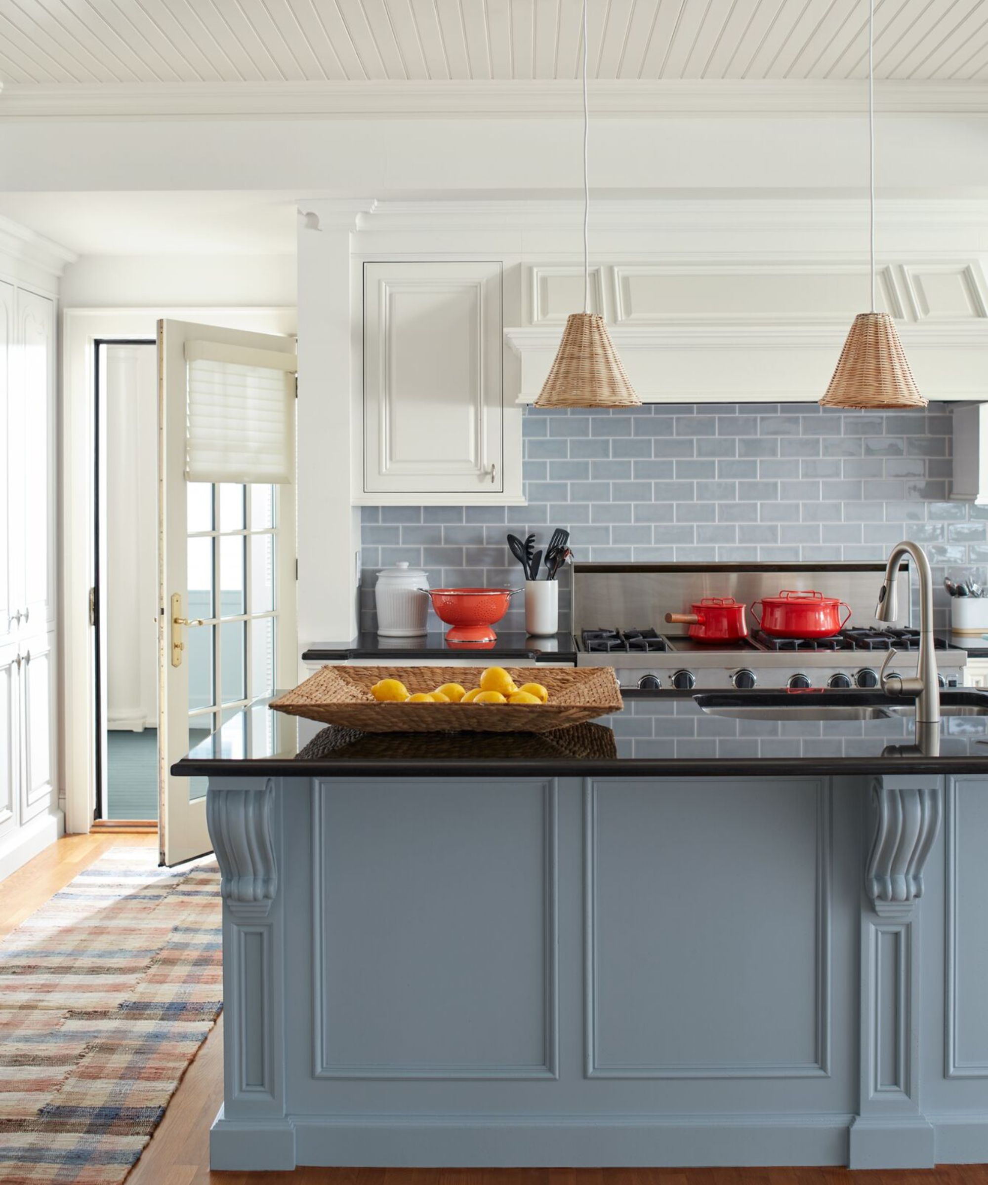 blue kitchen with white ceiling and cabinets