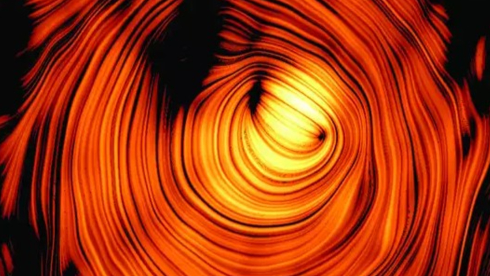Researchers have combined 15 years' worth of radio data to peer through the cone of a high-energy jet and unravel the magnetic mysteries of a "blazar" billions of light-years from Earth. The new findings also shed light on the origin of elusive "ghost particles."