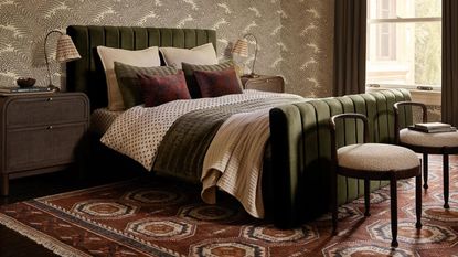 Fall bedroom with green velvet bed frame and red patterned rug