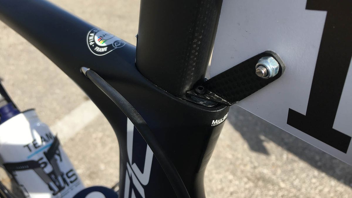 A small carbon number plate mount attaches seamlessly to the seat post clamp