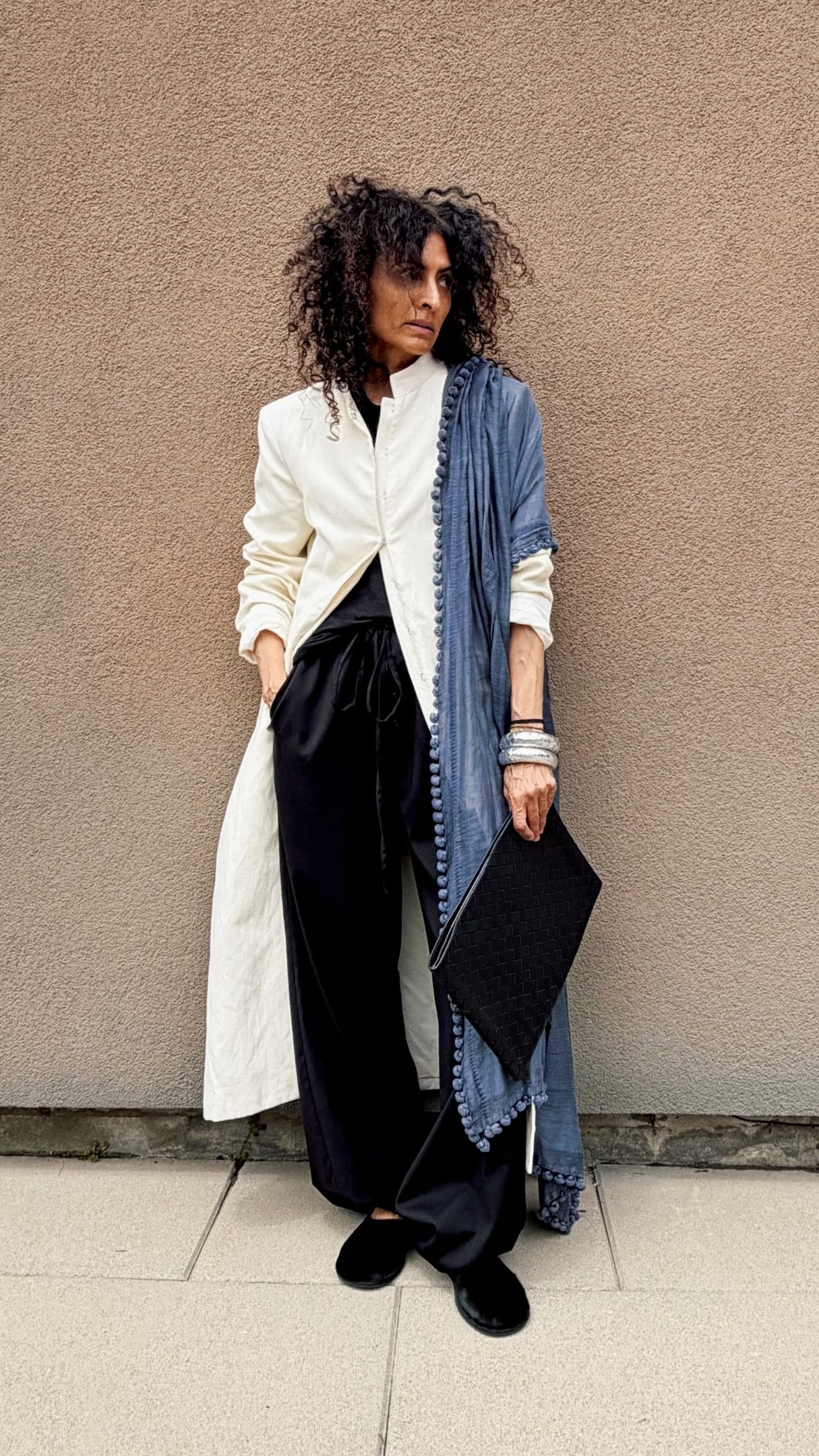 fashion content creator Neelam Gill wearing a pair of velvet smoking slippers