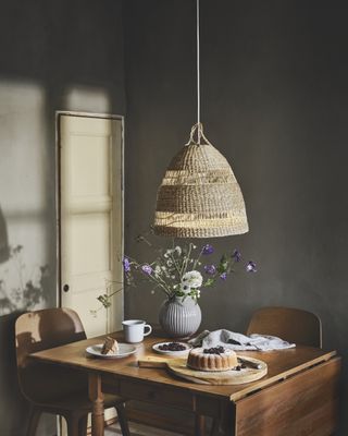 low lighting over a wooden table in a country kitchen diner setting