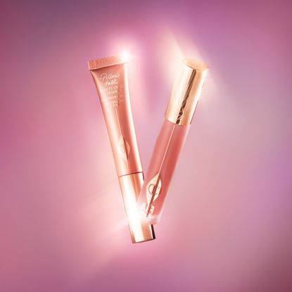 Charlotte Tilbury Beauty Light wand on a pink background