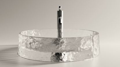 glass washbasin with brushed steel tap